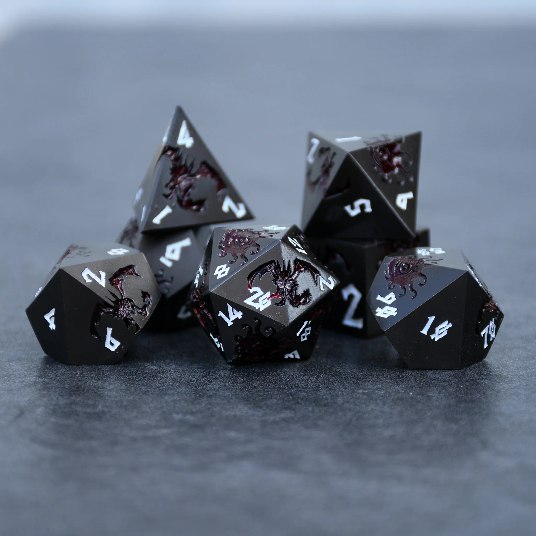 Misty Mountain - Monster Manual Dice: Gunmetal and Crimson - 7-set Metal Dice